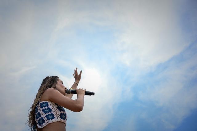 French-Brazilian singer Luiza performs on stage on the opening day of the 42nd Francofolies music festival in La Rochelle, western France, on July 10, 2026, as France endures a heatwave. (Photo by Philippe LOPEZ / AFP)