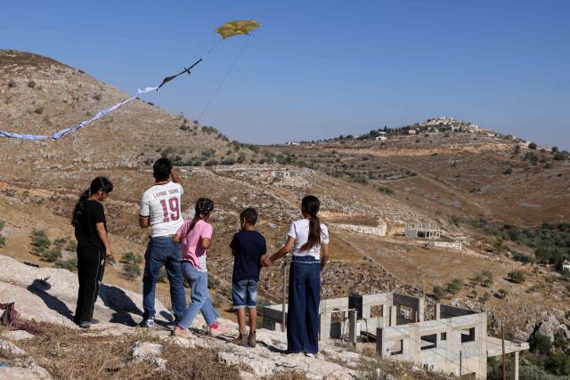 Palestinians and solidartiy activists fly kites towards the Israeli settelment of Har Bracha from the village of Burin, south of Nablus in the occupied West Bank on July 10, 2026. (Photo by JAAFAR ASHTIYEH / AFP)