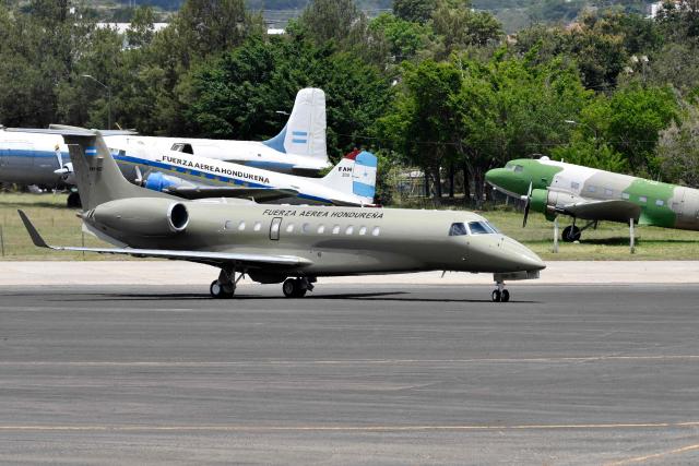 View of the Honduran presidential airplane after it was auctioned off as part of austerity measures, at the Hernan Acosta Mejia Air Base in Tegucigalpa on July 10, 2026. The Embraer Legacy 600 jet, which purchase and maintenance have been marred by allegations of corruption, was acquired by former Honduran President (2014–2022) Juan Orlando Hernandez. It was purchased on July 10, 2026 by THEBE, an engineering and consultancy firm based in Mexico. (Photo by Orlando SIERRA / AFP)