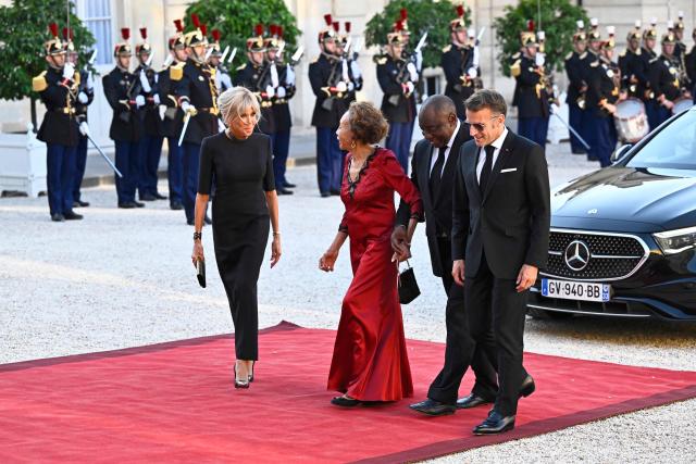 (From L) France's President's wife Brigitte Macron, South Africa's President's wife Tshepo Motsepe, South Africa's President Cyril Ramaphosa and France's President Emmanuel Macron,   arrive at The Elysee Presidential Palace to attend an official state dinner in Paris on July 10, 2026. (Photo by JULIEN DE ROSA / AFP)