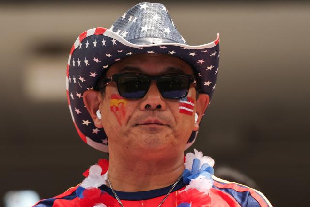 A Spanish fan wears a US themed hat ahead of the 2026 World Cup football tournament quarter-final match between Spain and Belgium at the Los Angeles Stadium in Inglewood on July 10, 2026.  (Photo by ETIENNE LAURENT / AFP)