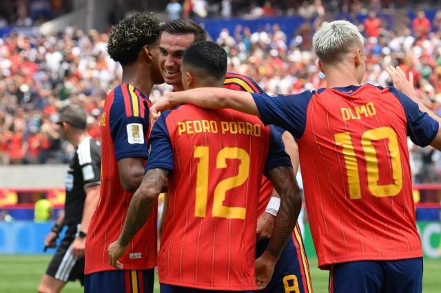Spain's midfielder #08 Fabian Ruiz celebrates scoring his team's first goal with teammates during the 2026 World Cup football tournament quarter-final match between Spain and Belgium at the Los Angeles Stadium in Inglewood on July 10, 2026.  (Photo by Patrick T. Fallon / AFP)