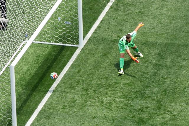 Spain's goalkeeper #23 Unai Simon concedes Belgium's first goal scored by forward #17 Charles De Ketelaere (unseen) during the 2026 World Cup football tournament quarter-final match between Spain and Belgium at the Los Angeles Stadium in Inglewood on July 10, 2026.  (Photo by VALERIE MACON / AFP)