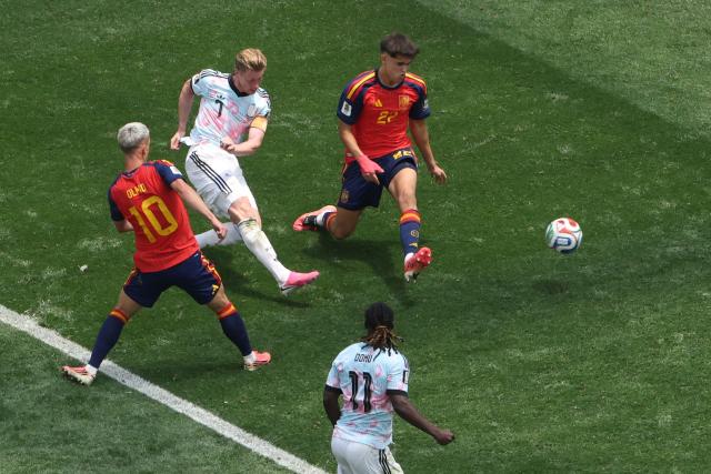 Belgium's midfielder #07 Kevin De Bruyne kicks the ball past Spain's defender #22 Pau Cubarsi and forward #10 Dani Olmo during the 2026 World Cup football tournament quarter-final match between Spain and Belgium at the Los Angeles Stadium in Inglewood on July 10, 2026.  (Photo by VALERIE MACON / AFP)
