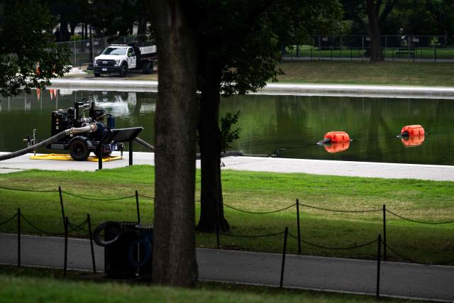 A vacuum assisted pump is seen adjacent to the Lincoln Memorial Reflecting pool on the National Mall in Washington, DC on July 10, 2026. (Photo by Kent Nishimura / AFP)
