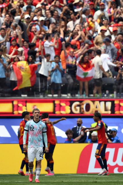 Belgium's forward #22 Alexis Saelemaekers reacts after conceding Spain's second goal scored by midfielder #06 Mikel Merino (unseen) during the 2026 World Cup football tournament quarter-final match between Spain and Belgium at the Los Angeles Stadium in Inglewood on July 10, 2026.  (Photo by Patrick T. Fallon / AFP)