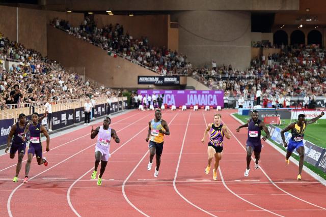 Jamaica's Oblique Seville (3L) crosses the finish line to win the men's 100m during the Diamond League athletics meeting at the Stade Louis II in Monaco on July 10, 2026. (Photo by Frederic DIDES / AFP)