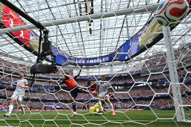 Spain's midfielder #06 Mikel Merino scores his team's second goal during the 2026 World Cup football tournament quarter-final match between Spain and Belgium at the Los Angeles Stadium in Inglewood on July 10, 2026.  (Photo by Paul ELLIS / AFP)