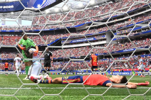 Spain's goalkeeper #23 Unai Simon conforts Belgium's forward #09 Romelu Lukaku as Spain's defender #22 Pau Cubarsi reacts during the 2026 World Cup football tournament quarter-final match between Spain and Belgium at the Los Angeles Stadium in Inglewood on July 10, 2026.  (Photo by Patrick T. Fallon / AFP)