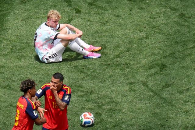 Spain's forward #19 Lamine Yamal and defender #12 Pedro Porro celebrate past Belgium's defender #18 Joaquin Seys after the 2026 World Cup football tournament quarter-final match between Spain and Belgium at the Los Angeles Stadium in Inglewood on July 10, 2026.  (Photo by VALERIE MACON / AFP)