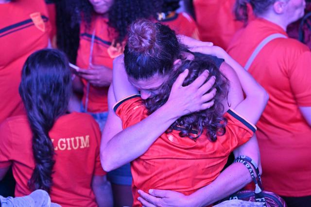 Fans react at a fan zone watch party of the 2026 World Cup quarter final football match between Spain and Belgium in Uccle near Brussels on July 10, 2026. (Photo by NICOLAS TUCAT / AFP)