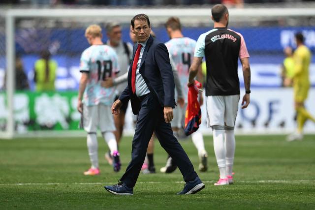 Belgium's French head coach Rudi Garcia leaves the field after losing the 2026 World Cup football tournament quarter-final match between Spain and Belgium at the Los Angeles Stadium in Inglewood on July 10, 2026.  (Photo by Patrick T. Fallon / AFP)