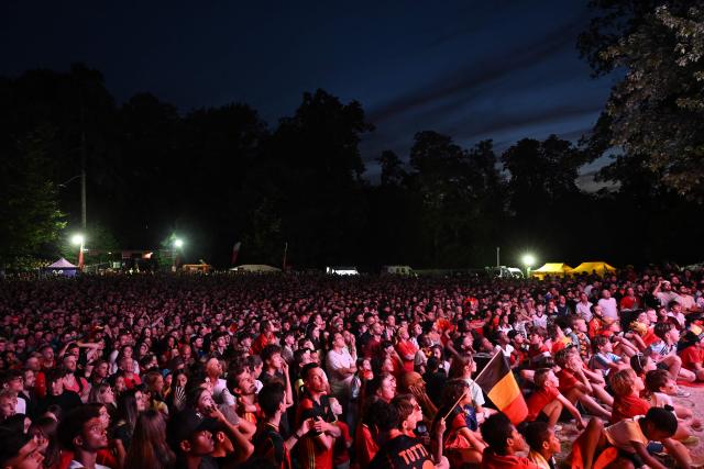 Spectators react at a fan zone watch party of the 2026 World Cup quarter final football match between Spain and Belgium in Uccle near Brussels on July 10, 2026. (Photo by Nicolas TUCAT / AFP)