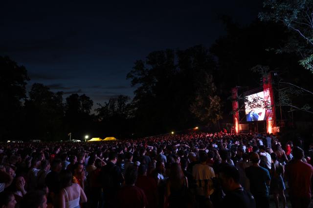 Spectators react at a fan zone watch party of the 2026 World Cup quarter final football match between Spain and Belgium in Uccle near Brussels on July 10, 2026. (Photo by Nicolas TUCAT / AFP)