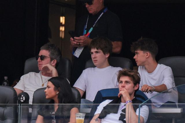 (2nd row) British musician Noel Gallagher (L), (1st row) US actress Nikki Rodriguez (L), and US actor Noah LaLonde (R) attend the 2026 World Cup football tournament quarter-final match between Spain and Belgium at the Los Angeles Stadium in Inglewood on July 10, 2026.  (Photo by Etienne LAURENT / AFP)