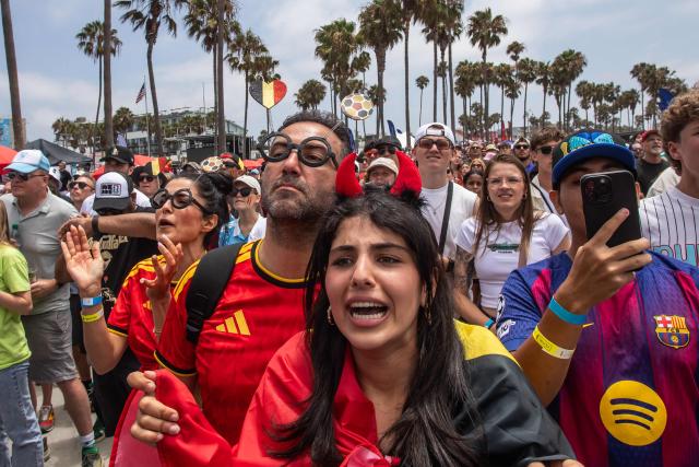 Belgium fans react as they attend a watch party for the World Cup quarterfinal match between Spain and Belgium at the Venice Beach FIFA Fan Festival in Venice, California, on July 10, 2026. (Photo by Apu GOMES / AFP)