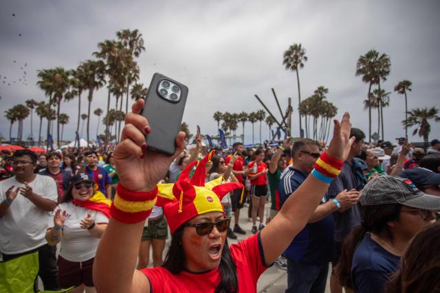 Spain fans celebrate their team's victory during a watch party for the World Cup quarterfinal match between Spain and Belgium at the Venice Beach FIFA Fan Festival in Venice, California, on July 10, 2026. (Photo by Apu GOMES / AFP)