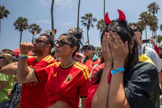 Belgium fans react as they attend a watch party for the World Cup quarterfinal match between Spain and Belgium at the Venice Beach FIFA Fan Festival in Venice, California, on July 10, 2026. (Photo by Apu GOMES / AFP)