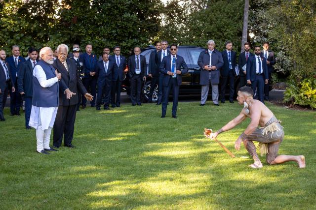 India's Prime Minister Narendra Modi (L) is welcomed with a traditional Maori challenge at Government House in Wellington on July 11, 2026. (Photo by BRUCE MACKAY / POOL / AFP)