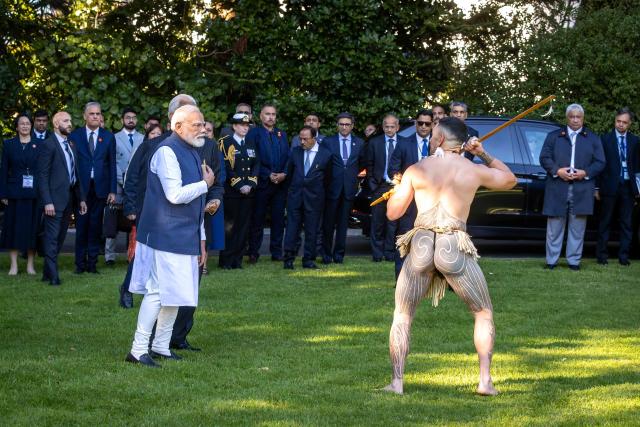 India's Prime Minister Narendra Modi is welcomed with a traditional Maori challenge at Government House in Wellington on July 11, 2026. (Photo by BRUCE MACKAY / POOL / AFP)