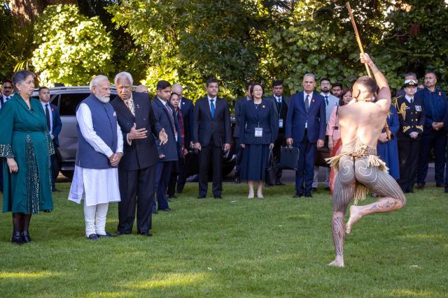 India's Prime Minister Narendra Modi (2nd-L) is welcomed with a traditional Maori challenge at Government House in Wellington on July 11, 2026. (Photo by BRUCE MACKAY / POOL / AFP)