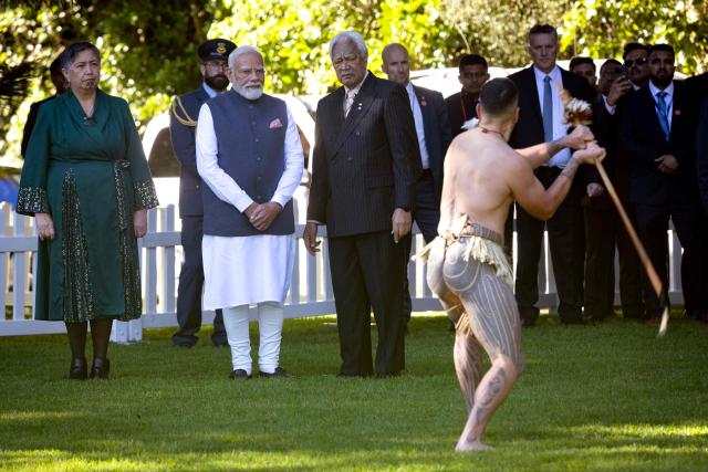 India's Prime Minister Narendra Modi (2nd-L) is welcomed with a traditional Maori challenge at Government House in Auckland on July 11, 2026. (Photo by Dean Purcell / POOL / AFP)