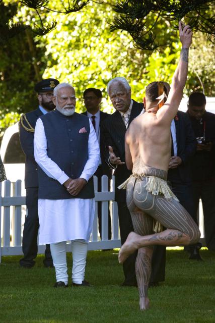 India's Prime Minister Narendra Modi (L) is welcomed with a traditional Maori challenge at Government House in Auckland on July 11, 2026. (Photo by Dean Purcell / POOL / AFP)