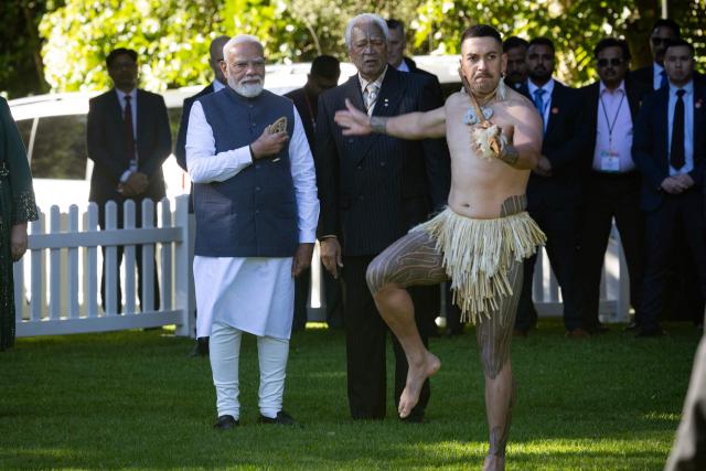 India's Prime Minister Narendra Modi (L) is welcomed with a traditional Maori challenge at Government House in Auckland on July 11, 2026. (Photo by Dean Purcell / POOL / AFP)