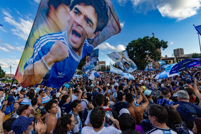 Argentine fans wave flags depicting Argentine football legend Diego Maradona in a gathering in Kansas City on July 10, 2026, on the eve of the 2026 World Cup football match between Argentina and Switzerland. (Photo by Odd Andersen / AFP)
