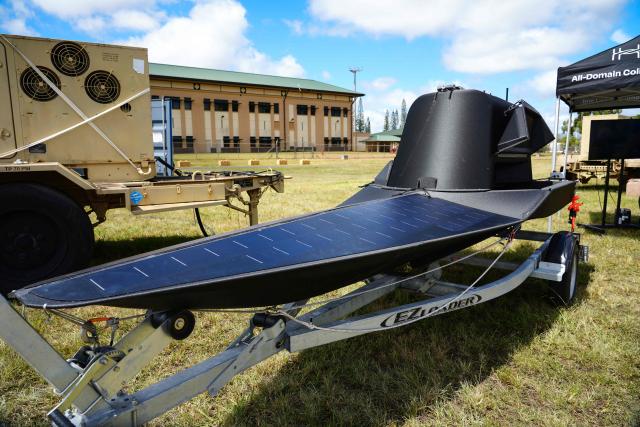 An autonomous surface vessel is displayed during an advance manufacturing demonstration by AI-powered technology platform FleetWorks during the Exercise Rim of the Pacific (RIMPAC) in Oahu, Hawaii, on July 10, 2026. (Photo by Michelle Bir / AFP)