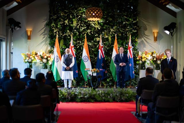 India's Prime Minister Narendra Modi (L) and New Zealand Prime Minister Christopher Luxon (R) pose during an Exchanging of Arrangements at Government House in Auckland on July 11, 2026. (Photo by Dean Purcell / POOL / AFP)