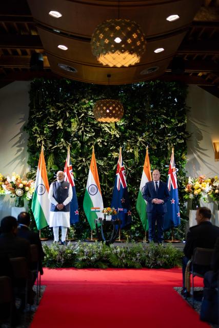 India's Prime Minister Narendra Modi (L) and New Zealand Prime Minister Christopher Luxon (R) pose during an Exchanging of Arrangements at Government House in Auckland on July 11, 2026. (Photo by Dean Purcell / POOL / AFP)