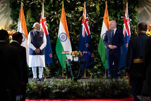 India's Prime Minister Narendra Modi (L) and New Zealand Prime Minister Christopher Luxon (R) pose during an Exchanging of Arrangements at Government House in Auckland on July 11, 2026. (Photo by Dean Purcell / POOL / AFP)