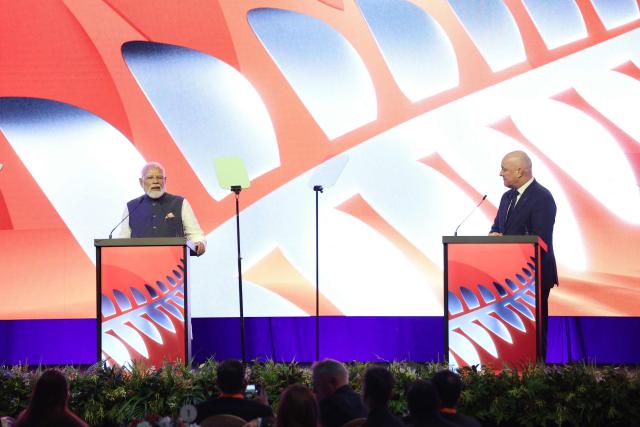Indian Prime Minister Narendra Modi (L) and New Zealand Prime Minister Christopher Luxon (R) attend the Winning Partnership Celebration in Auckland on July 11, 2026. (Photo by Michael Bradley / POOL / AFP)