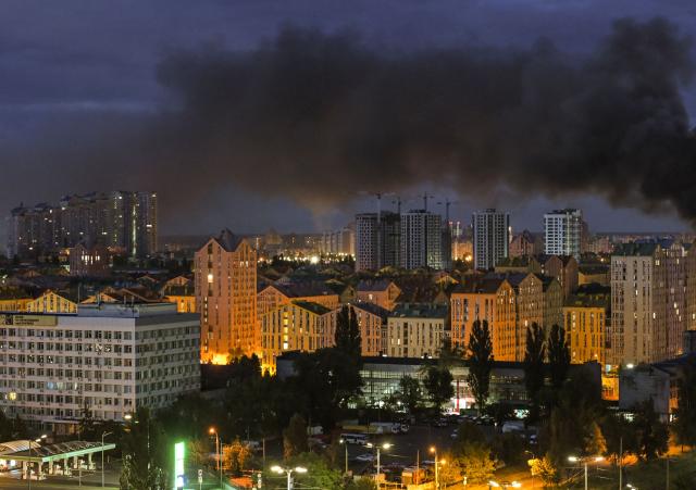 This photo shows smoke rising during Russian missile strikes on the Ukrainian capital of Kyiv early on July 11, 2026, amid the Russian invasion in Ukraine. Ukraine said Russian missile strikes on Kyiv wounded six people, as Moscow escalates attacks on the Ukrainian capital. AFP journalists in Kyiv heard two series of explosions in the early hours of Saturday, with an air alert siren sounding minutes after the first blast. (Photo by Evgen KOTENKO / AFP)