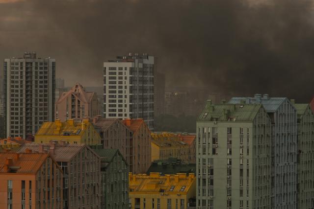 This photo shows smoke rising during Russian missile strikes on the Ukrainian capital of Kyiv early on July 11, 2026, amid the Russian invasion in Ukraine. Ukraine said Russian missile strikes on Kyiv wounded six people, as Moscow escalates attacks on the Ukrainian capital. AFP journalists in Kyiv heard two series of explosions in the early hours of Saturday, with an air alert siren sounding minutes after the first blast. (Photo by Evgen KOTENKO / AFP)