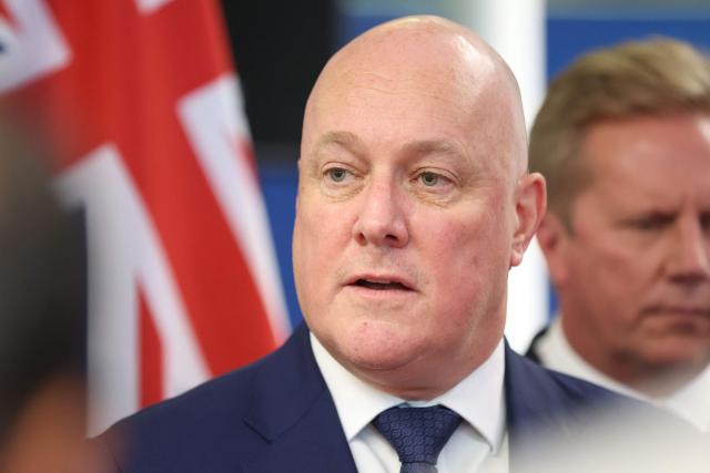 New Zealand Prime Minister Christopher Luxon speaks to the media after events with Indian Prime Minister Narendra Modi (not pictured) in Auckland on July 11, 2026. (Photo by Michael Bradley / POOL / AFP)