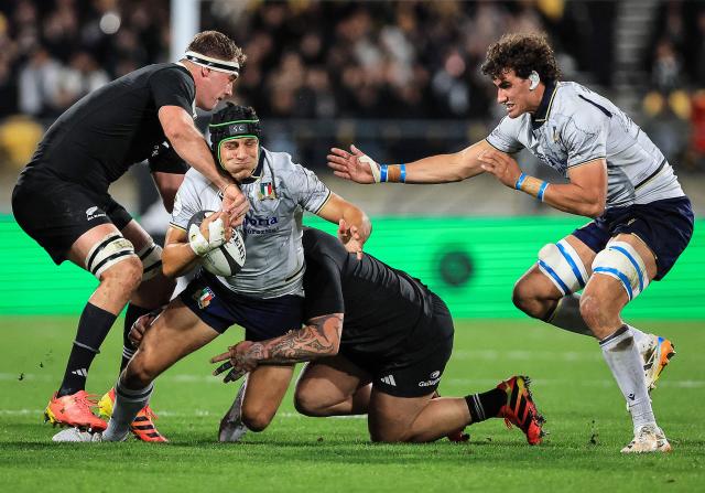 Juan Ignacio Brex of Italy is tackled by Sam Darry of New Zealand during the Nations Championship match between the New Zealand All Blacks and Italy at HNRY Stadium in Wellington on July 11, 2026. (Photo by Grant Down / AFP)