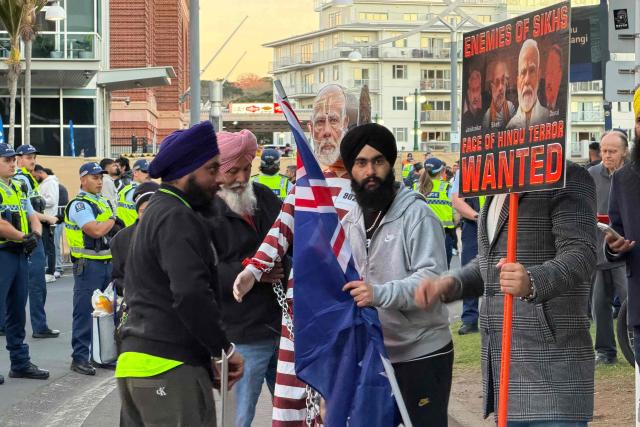 CORRECTION / Members of the local Sikh community protest outside a venue where India's Prime Minister Narendra Modi is appearing in front of 10,000 members of the local Indian community in Auckland on July 11, 2026. (Photo by Ben STRANG / AFP) / “The erroneous mention[s] appearing in the metadata of this photo by Ben STRANG has been modified in AFP systems in the following manner: AFP as source instead of POOL. Please immediately remove the erroneous mention[s] from all your online services and delete it (them) from your servers. If you have been authorized by AFP to distribute it (them) to third parties, please ensure that the same actions are carried out by them. Failure to promptly comply with these instructions will entail liability on your part for any continued or post notification usage. Therefore we thank you very much for all your attention and prompt action. We are sorry for the inconvenience this notification may cause and remain at your disposal for any further information you may require.”