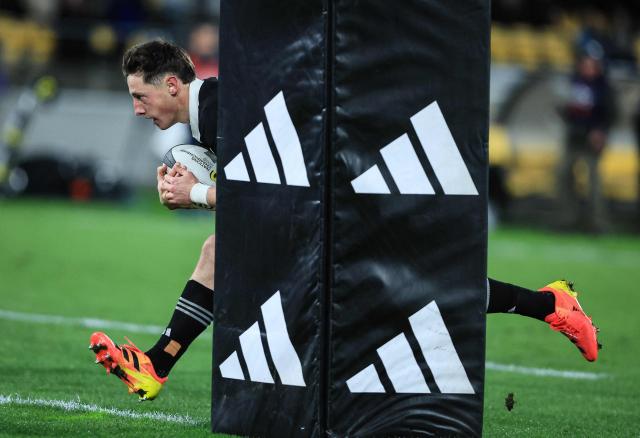 Cam Roigard of New Zealand dives in for a try during the rugby union Nations Championship match between the New Zealand All Blacks and Italy at HNRY Stadium in Wellington on July 11, 2026. (Photo by Grant Down / AFP)