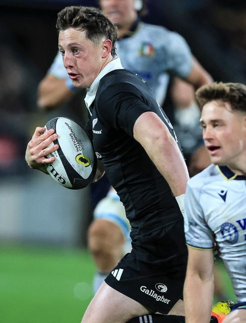 Cam Roigard of New Zealand heads for the try line during the rugby union Nations Championship match between the New Zealand All Blacks and Italy at HNRY Stadium in Wellington on July 11, 2026. (Photo by Grant Down / AFP)