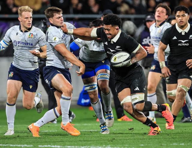 Ardie Savea (centre R) of New Zealand fends off Leonardo Marin (centre L) of Italy during the rugby union Nations Championship match between New Zealand and Italy at HNRY Stadium in Wellington on July 11, 2026. (Photo by Grant Down / AFP)