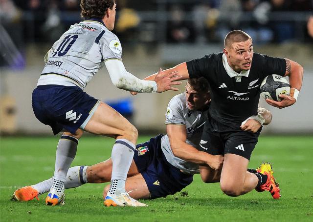 Cortez Ratima (R) of New Zealand is tackled by Leonardo Marin (C) of Italy during the rugby union Nations Championship match between New Zealand and Italy at HNRY Stadium in Wellington on July 11, 2026. (Photo by Grant Down / AFP)