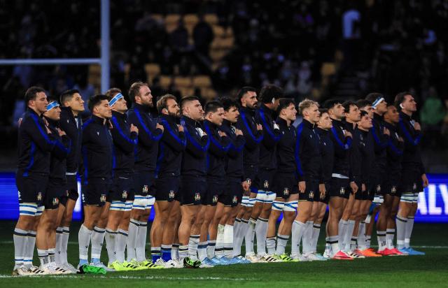 Italy's players sing the national anthem before the rugby union Nations Championship match between New Zealand and Italy at HNRY Stadium in Wellington on July 11, 2026. (Photo by Grant Down / AFP)