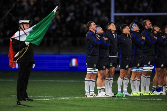 Italy's players sing the national anthem before the rugby union Nations Championship match between New Zealand and Italy at HNRY Stadium in Wellington on July 11, 2026. (Photo by Grant Down / AFP)