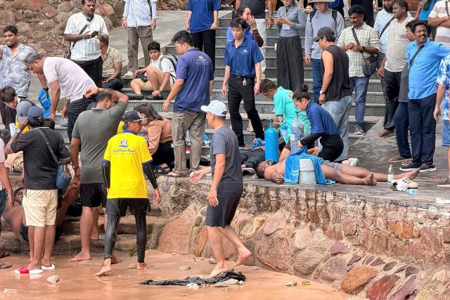 EDITORS NOTE: Graphic content / People help victims of a boating accident after a tourist vessel capsized off Phu Quoc Island in southern Vietnam's An Giang Province on July 11, 2026. At least 15 people were killed when a tourist boat capsized off an island in Vietnam's south, state media reported on July 11. (Photo by AFP)