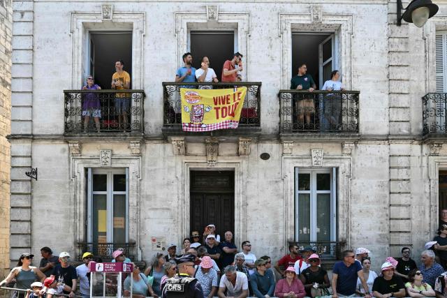 Spectators line the race route at the start of the 8th stage of the 113th edition of the Tour de France cycling race, 182 km between Périgueux and Bergerac in southwestern France, on July 11, 2026. (Photo by Jeff PACHOUD / AFP)