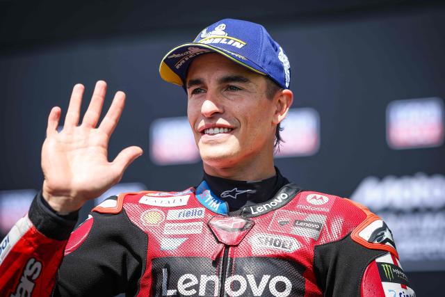 Ducati Lenovo Team's Spanish MotoGP rider Marc Marquez reacts after winning the qualifiying session of the German Motorcycle MotoGP Grand Prix at the Sachsenring race track in Hohenstein-Ernstthal near Chemnitz, eastern Germany, on July 11, 2026. (Photo by Ronny HARTMANN / AFP)