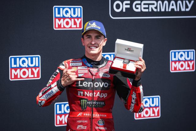 Ducati Lenovo Team's Spanish MotoGP rider Marc Marquez reacts after winning the qualifiying session of the German Motorcycle MotoGP Grand Prix at the Sachsenring race track in Hohenstein-Ernstthal near Chemnitz, eastern Germany, on July 11, 2026. (Photo by Ronny HARTMANN / AFP)
