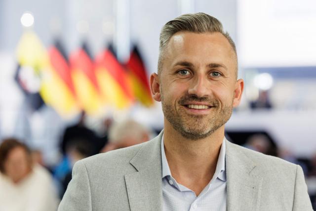 Ulrich Siegmund, the far-right Alternative for Germany (AfD) party's top candidate for the regional elections in the eastern federal state of Saxony-Anhalt, poses for a photo during the state party convention of his AfD party in Magdeburg, eastern Germany on July 11, 2026. At its party conference, the AfD presented its 100-day programme for the period following the state election scheduled for September 6, 2026. (Photo by Jens SCHLÜTER / AFP)